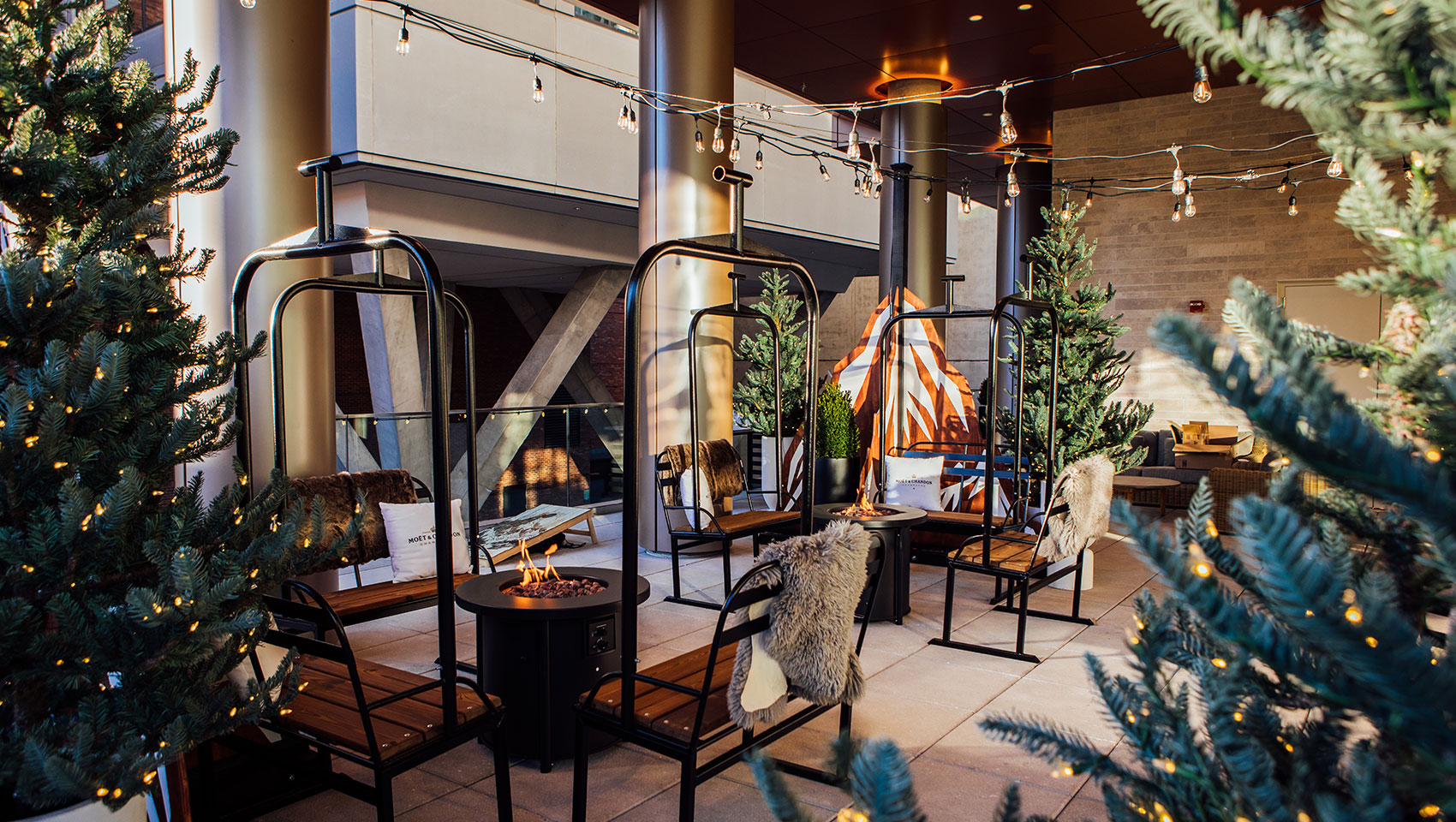 Chalet at Claret with ski chair seating, fire pits and twinkle lights on trees