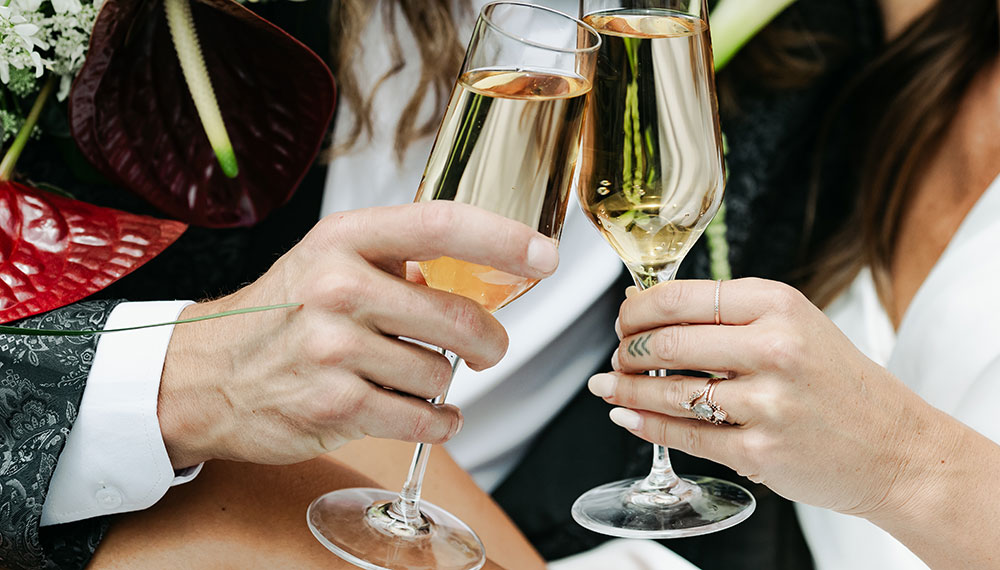 Bride and Groom toast with sparkling wine