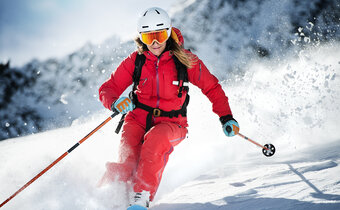 Skier in orange jacket