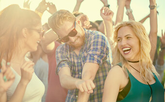 people dancing at an outdoor concert
